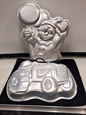 2 Vtg Wilton Cake Molds.  Clown With Ballons And Tractor. Good Condition.